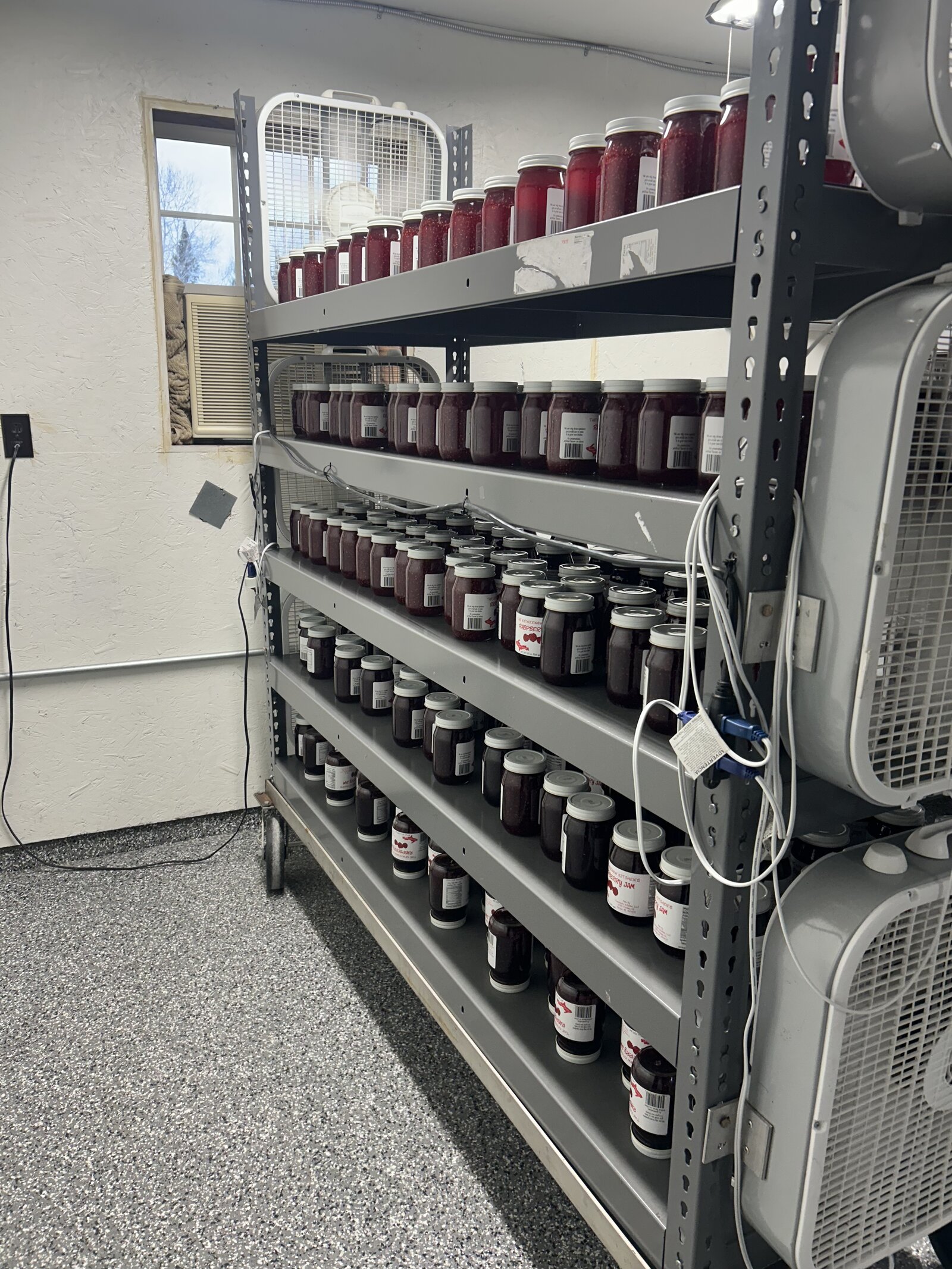 Shelves of finished Keweenaw Kitchen jams